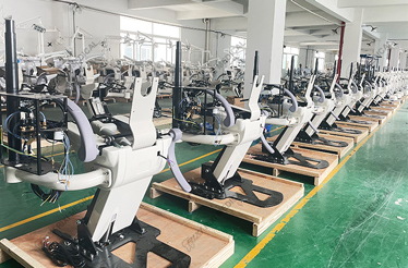 A high-quality dental chair on a factory line, ready for branding by a dental chair OEM manufacturer.